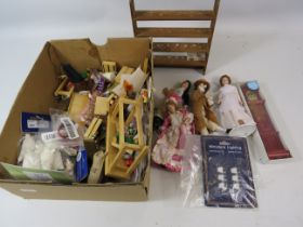 Box of dolls house dolls and accessories.