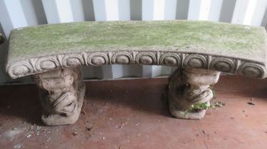 Reconstituted Stone Quadrant Garden benches raised on twin supports decorated with stylised Dolphins