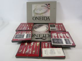 Selection of unsed Oneida cutlery and trays.