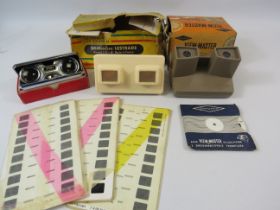 2 vintage viewmasters and slides and a pair of sports binoculars.