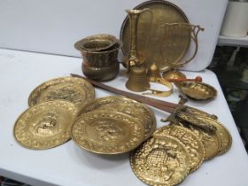 Large selection of brass wall plaques, pair of decorative swords, plantpots etc.