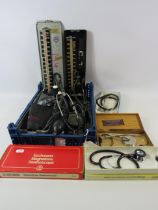 2 Vintage blood pressure monitors and a number of stethoscopes.