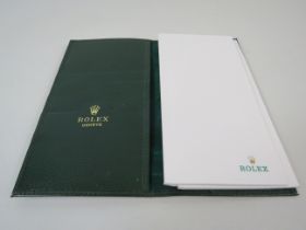 Rolex green leather wallet / note book holder and 2 note books.