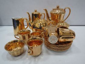 Gold Wade coffee set and Royal worcester gold teapot and coffee pot.