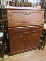 Late 20th Century Teak Bureau with long drawer under. Raised on a plinthed base it measures H:43 x