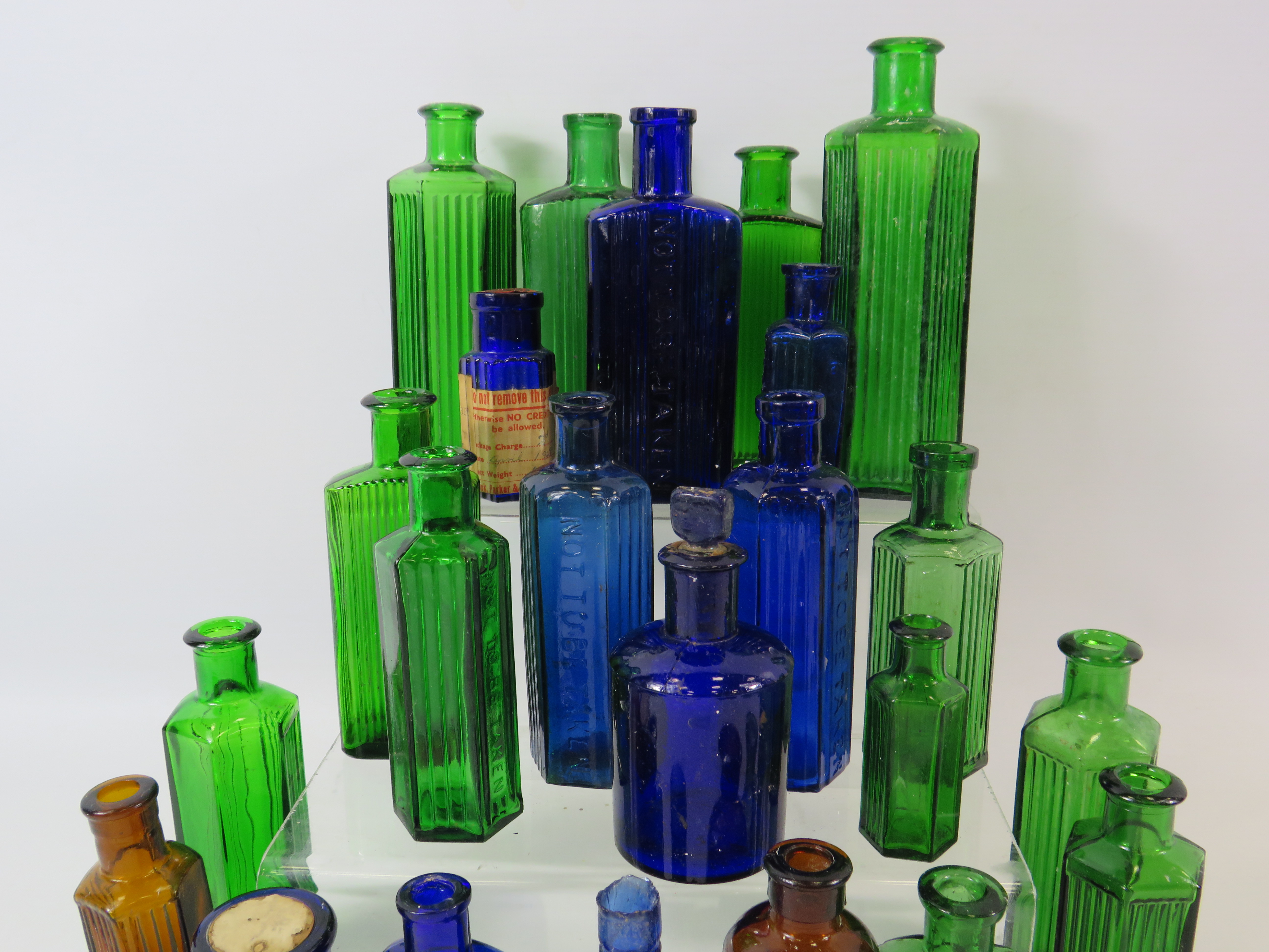 23 Vintage coloured medicine bottles, blue, green and brown. - Image 2 of 2