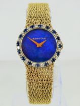 Ladies Bueche-Girod wristwatch. Bezel is encirled by Sapphires and Diamonds. The face is Lapis Lazul