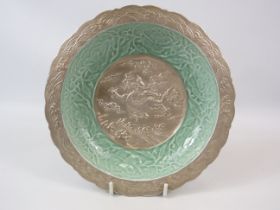 Chinese bowl made from metal and ceramic with dragon detail, Qinglong mark to the base.