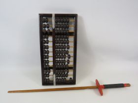 Vintage chinese Abacus and a wooden decorative sword.