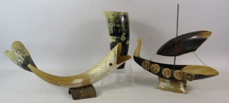 A Cow horn fish sculpture, viking boat and tankard.