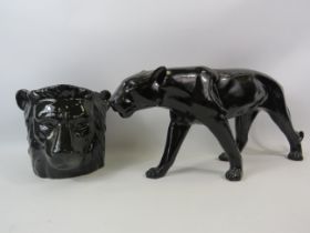 Resin black panther sculpture 8.5" tall & 18" long plus a lion head planter.