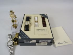 Kenneth Cole reaction ladies wristwatch unsed in the box plus 2 other watches and a bracelet.