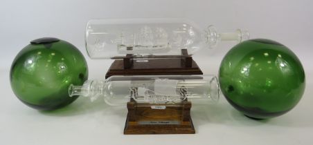2 Glass ships in bottles and 2 green glass shipping bouys.