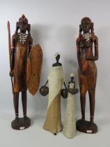 2 Large wooden ethnic carved figurines , approx 25" tall. Plus 2 smaller resin figurines.