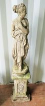 Reconstituted Stone Classical garden ornament raised on a plinth in lovely weathered condition. Mea