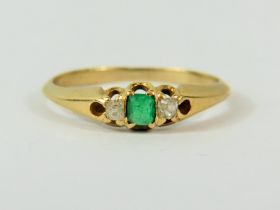 Ring set with central Emerald and flanked by twin Diamonds. No hallmark visable but chem testing to