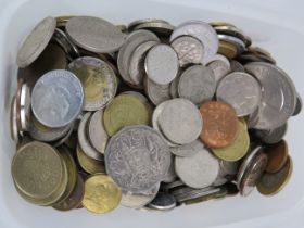 Tub containing a large quantity of foreign coins.