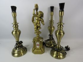 Gilt metal ornate cherub lamp base with ceramic panels plus 3 polished brass table lamps.