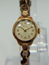 Swiss Made ladies watch by 'Pioneer' in running order. 9ct Gold case. Worn leather strap. See photos