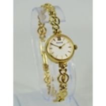 Accurist ladies watch with 9ct case and strap. Total weight 10.1g . Non runner for spares or repairs