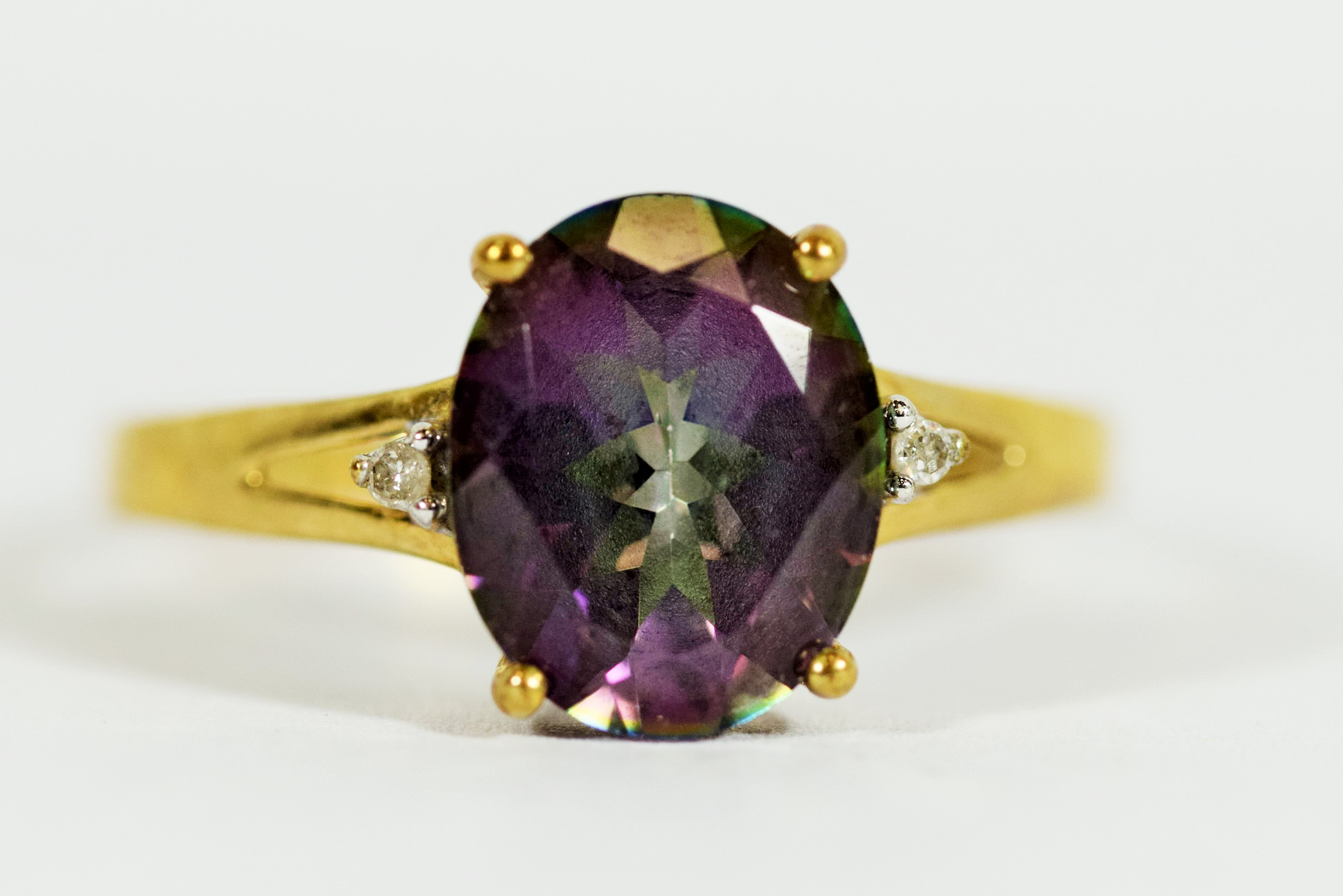 9ct Yellow Gold ring set with a Central Mystic Topaz which measures 11 x 8 mm, Accompanied by two Me
