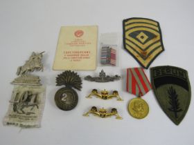 Selection of various military cap badges etc.