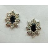 Pair of 9ct Gold Ear studs 1.3g set with Central Sapphire and CZ surround. 20mm wide.  Total weight 