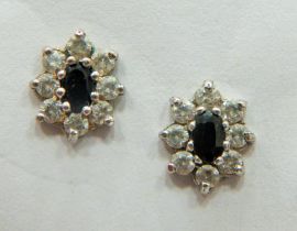 Pair of 9ct Gold Ear studs 1.3g set with Central Sapphire and CZ surround. 20mm wide. Total weight