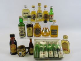 Selection of vintage miniature whiskeys and wines.