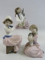 3 Nao figurines of girls with animals.