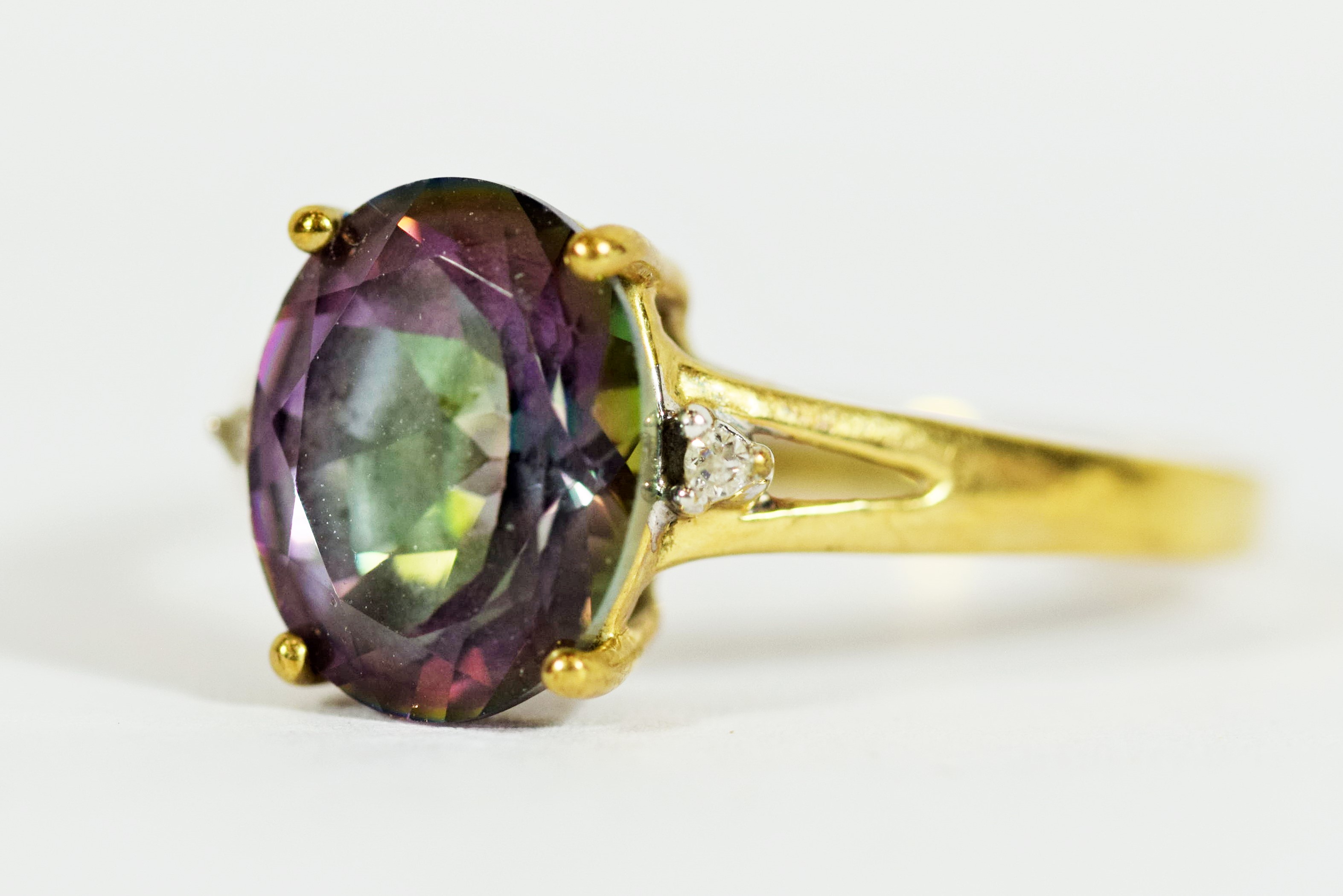 9ct Yellow Gold ring set with a Central Mystic Topaz which measures 11 x 8 mm, Accompanied by two Me - Image 2 of 3