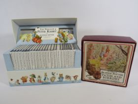 The World of Peter Rabbit Beatrix Potter book set and Paths and burrows game.