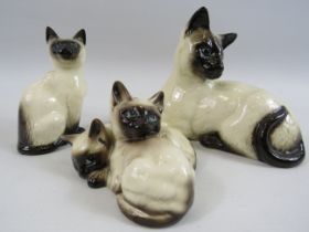 3 Beswick Siamese cat figurines.