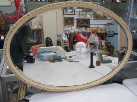 Bevelled edge oval mirror with original hanging chain. It measures approx 37 x 25 inches. See photos
