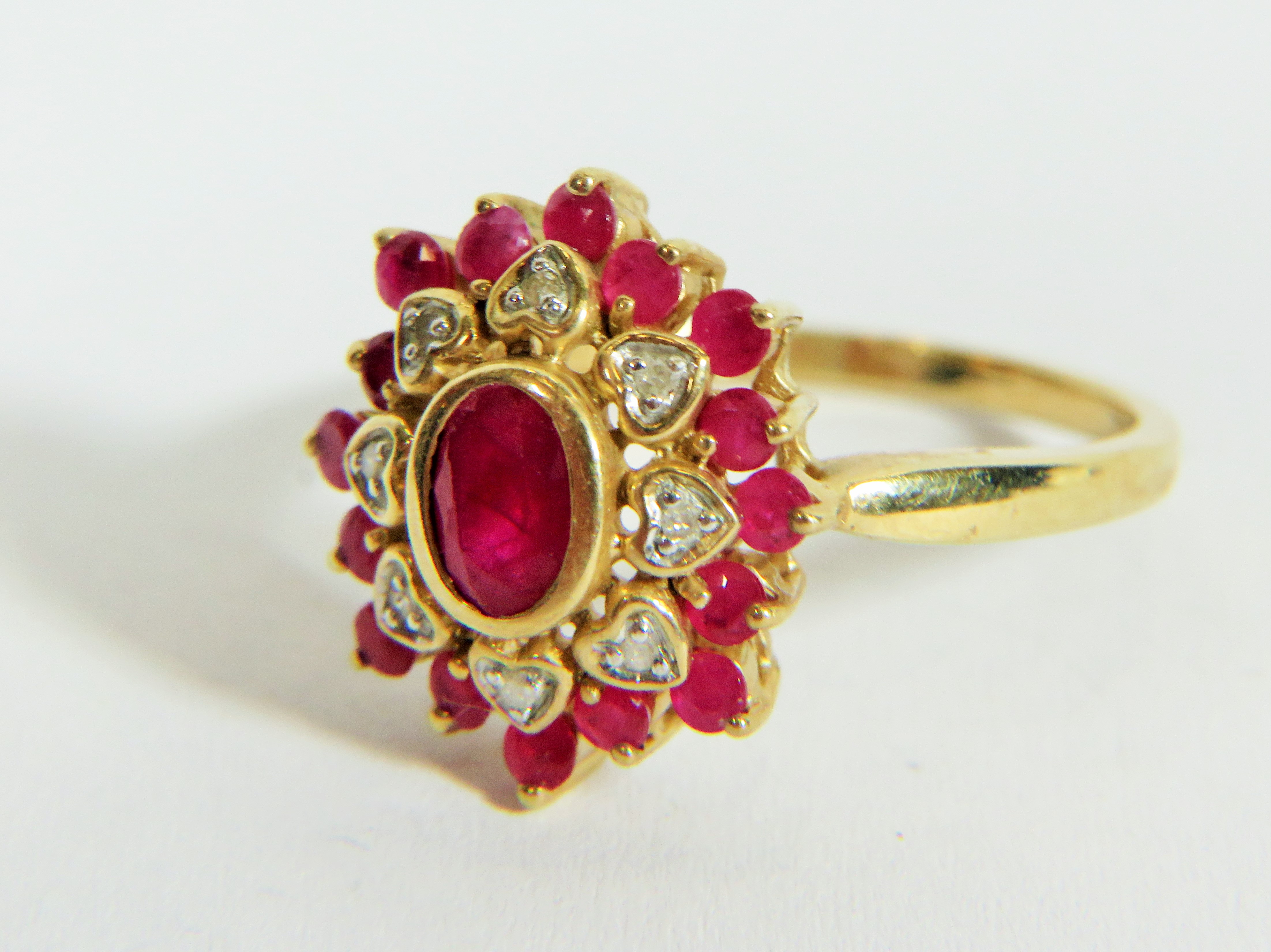 9ct Yellow Gold Diamond and Ruby set Flower pattern ring. Finger size 'P'  3.9g