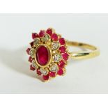 9ct Yellow Gold Diamond and Ruby set Flower pattern ring. Finger size 'P'  3.9g