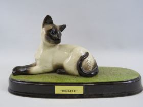 Beswick Siamese cat on ceramic named "Watch it" plaque 6" tall and 11" long.