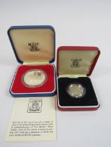 1983 Royal mint silver pound coin and a 1977 silver queens jubilee crown.