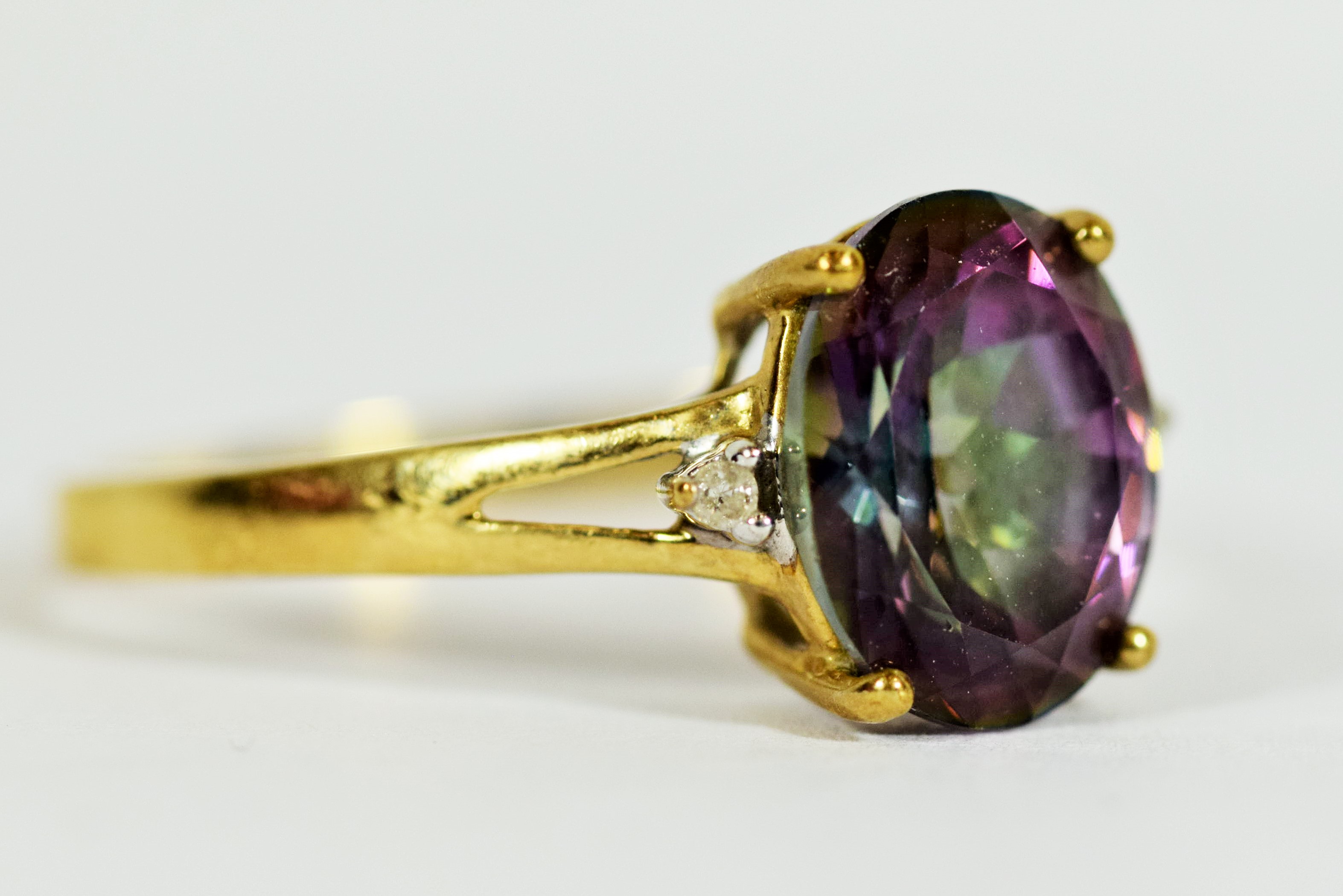 9ct Yellow Gold ring set with a Central Mystic Topaz which measures 11 x 8 mm, Accompanied by two Me - Image 3 of 3