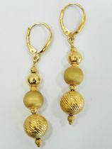 Lovely Pair of 9ct Gold Graduated ball drop earrings. Each earring measures approx 50mm long. Total