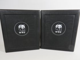 Two well presented leatherette albums of WWF Presentation stamps & FDC's. See photos.