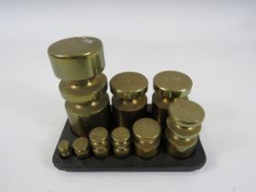 Set of Metric weights in a cast iron base.