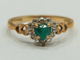 9ct Yellow Gold ring set with a Central Heart shaped Emerald with Melee Diamond surround. Finger s