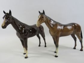 2 Beswick Bay race horse figurines in different colourways.