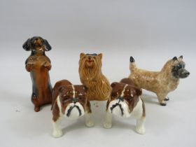 5 small Beswick dog figurines.