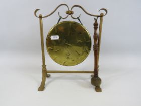 Vintage brass dinner gong, 9" tall and 8.5" wide.