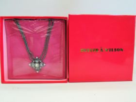 Unused and boxed. Buter & Wilson pendant with a 16 inch chain. Still in cellowrap in original box. S