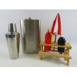 Mixed lot to include a large hip flask, cocktail shaker and a novelty condiment set.