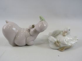 2 Nao figurines, hippo with frog on his nose and two ducks.
