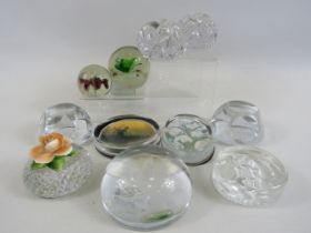 11 Glass paperweights.